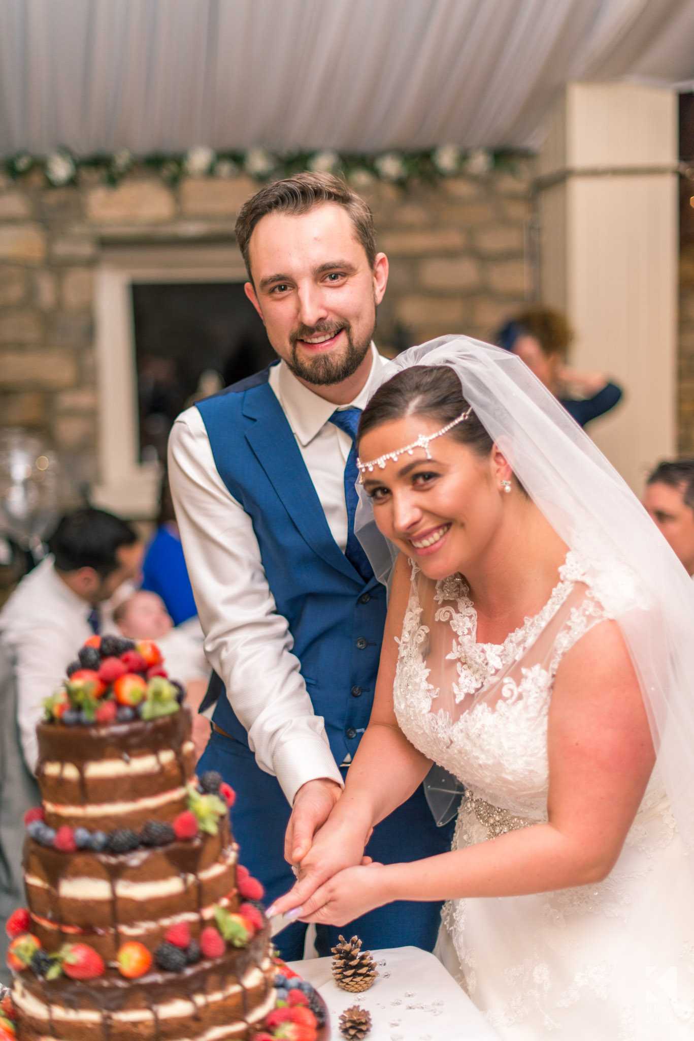 Bride and Groom cutting the cake