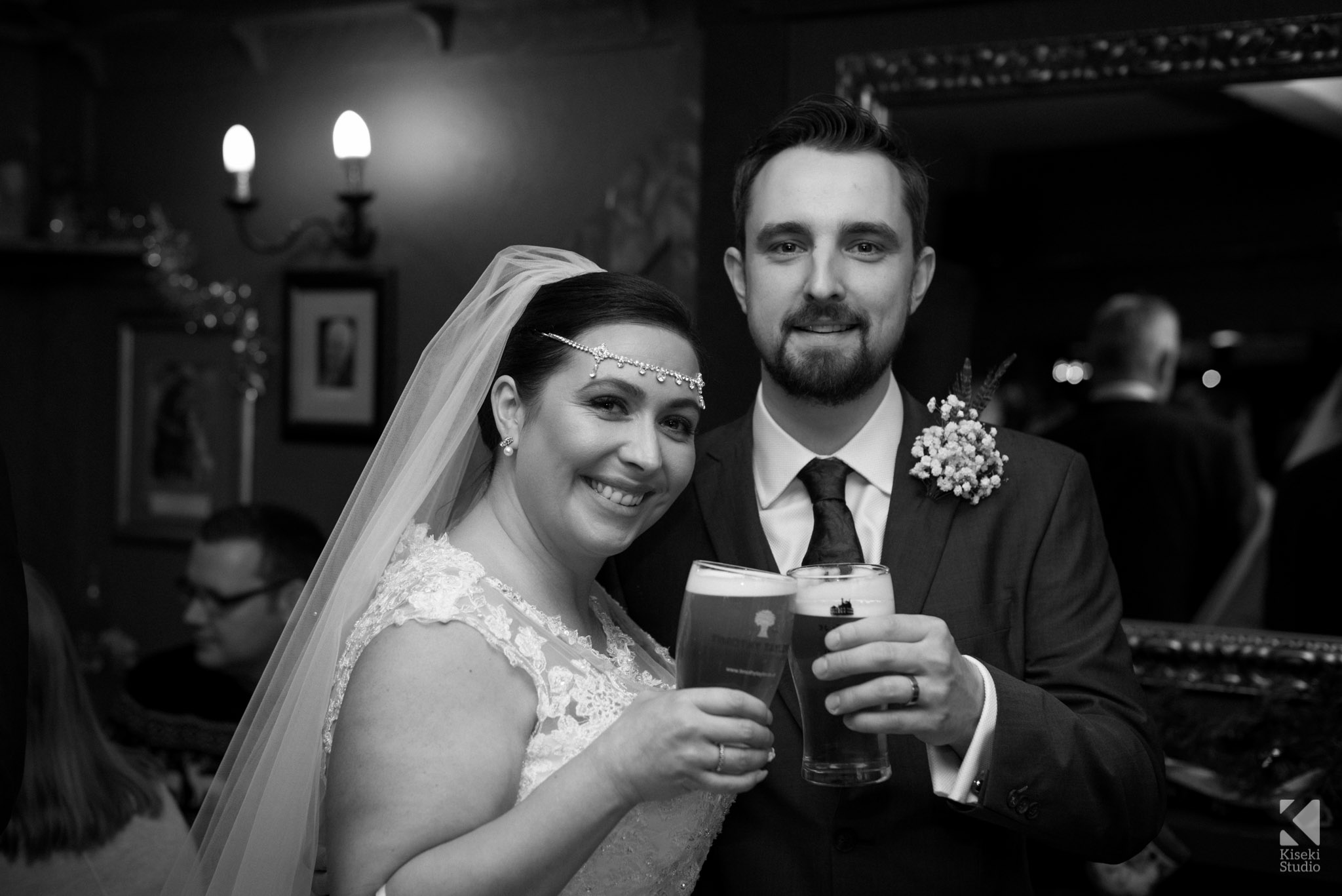 Bride and Groom having a pint in the Woolpack