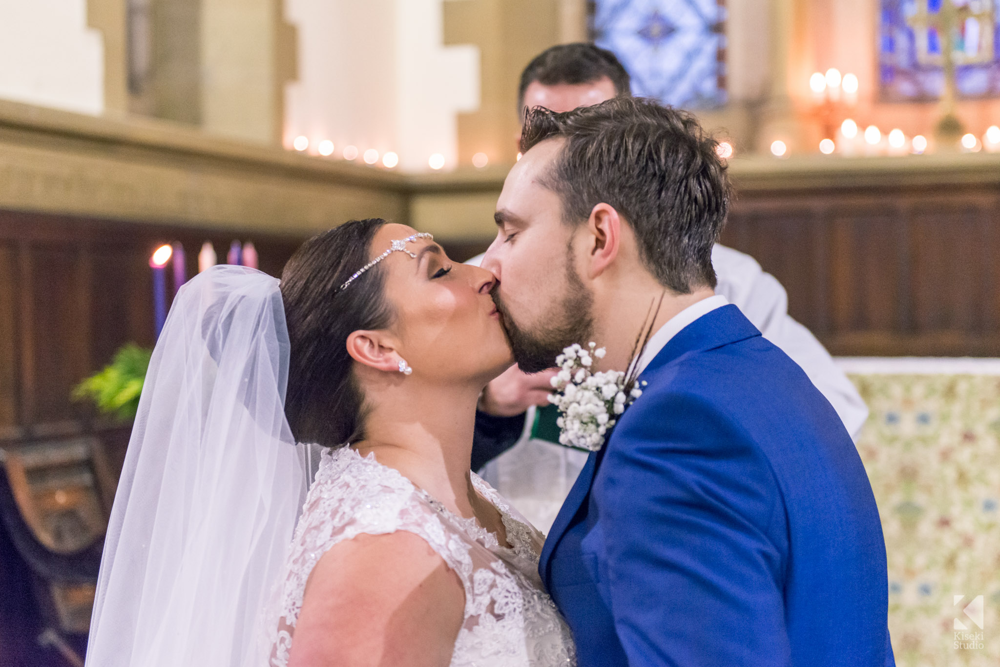 Bride and Groom kissing in the church