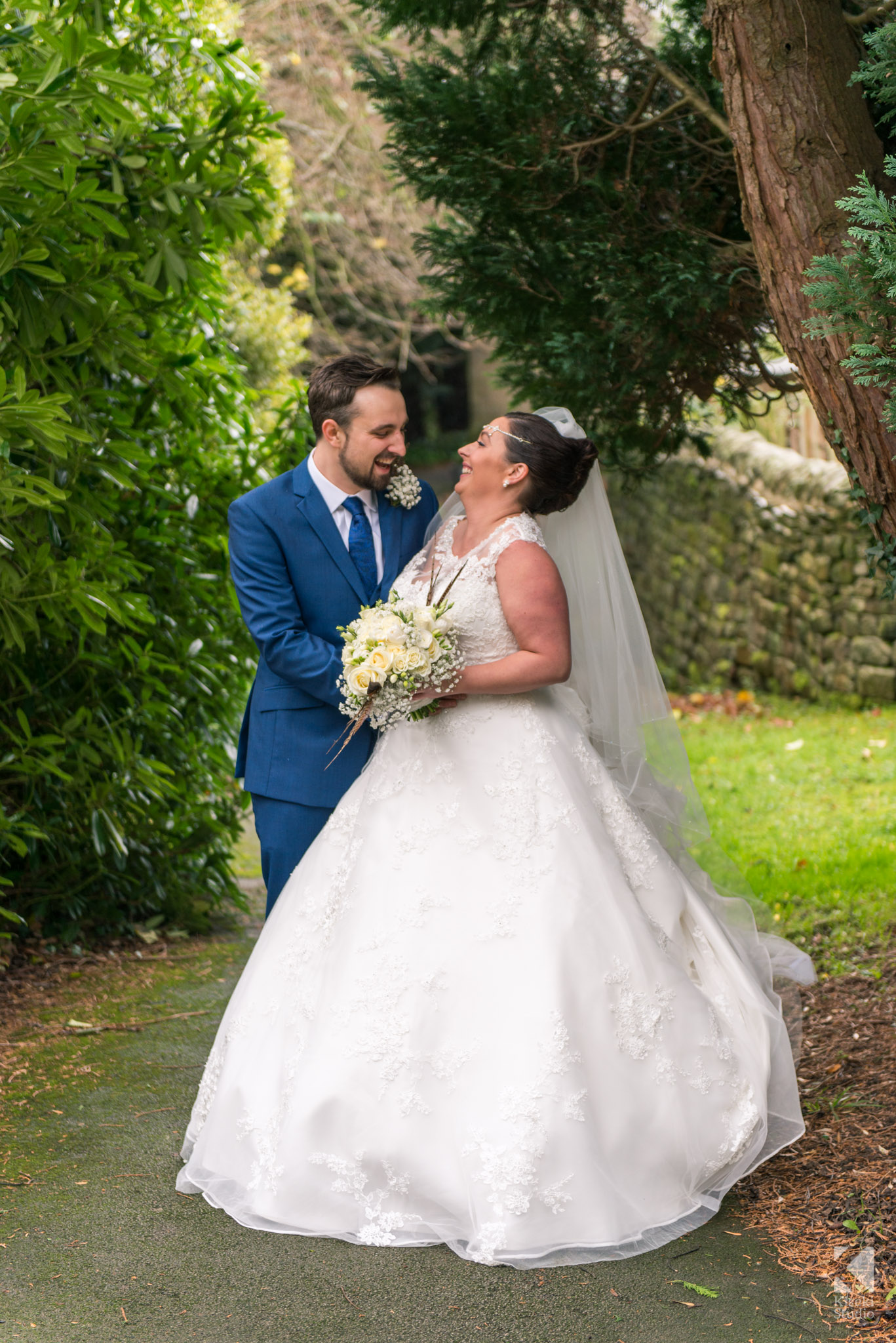 Bride and Groom sharing a moment outside the church