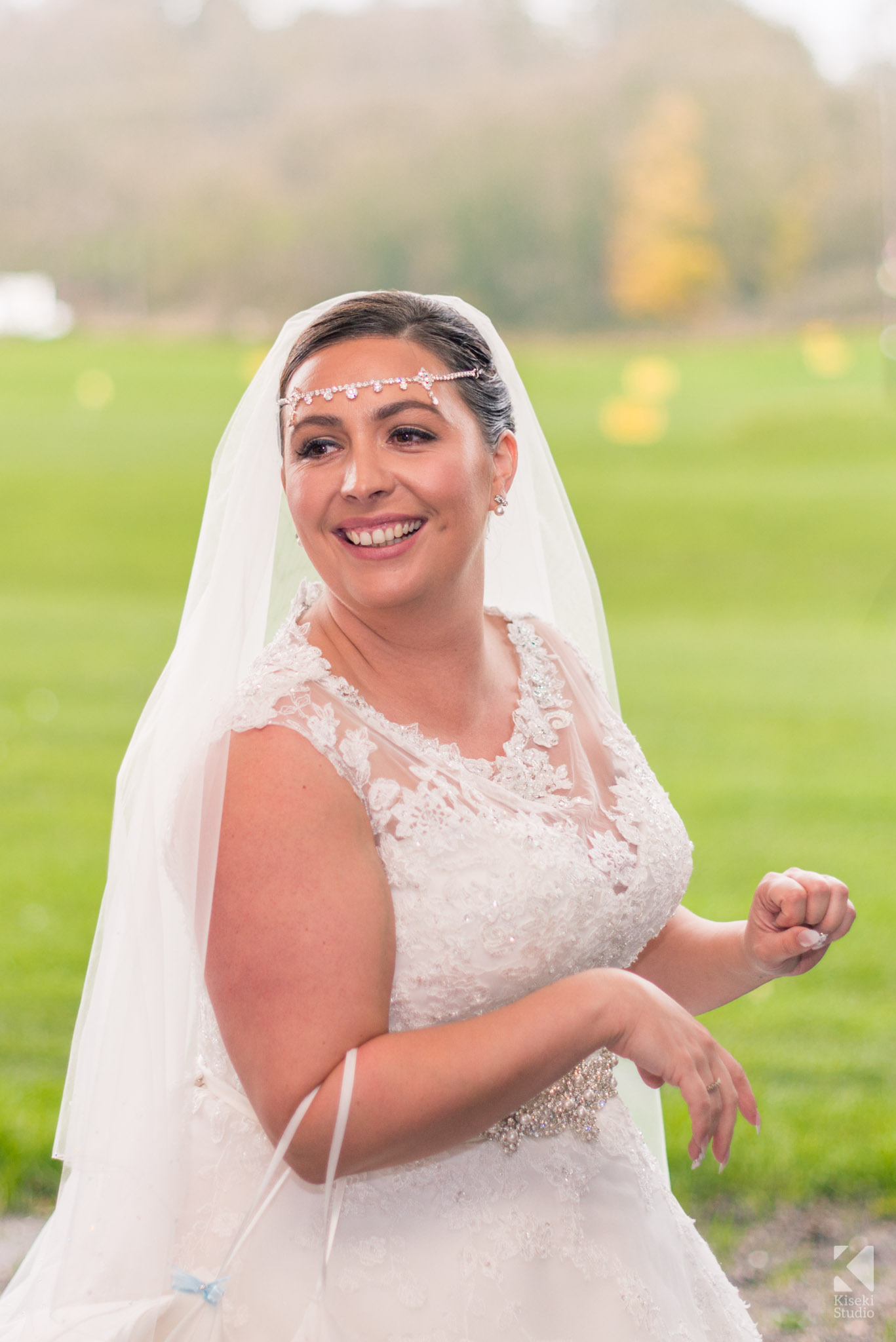 Bride posing a the golf driving range