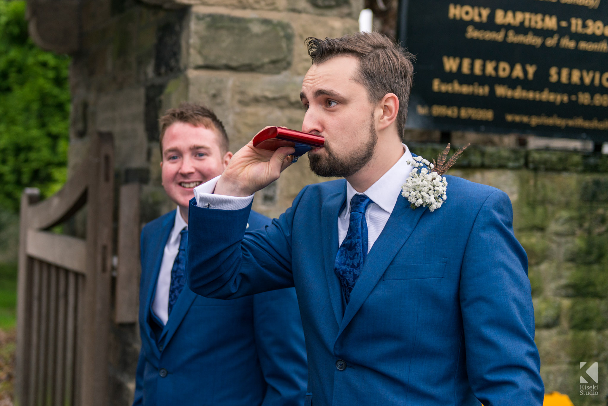 Groom having a cheeky pre-wedding drink