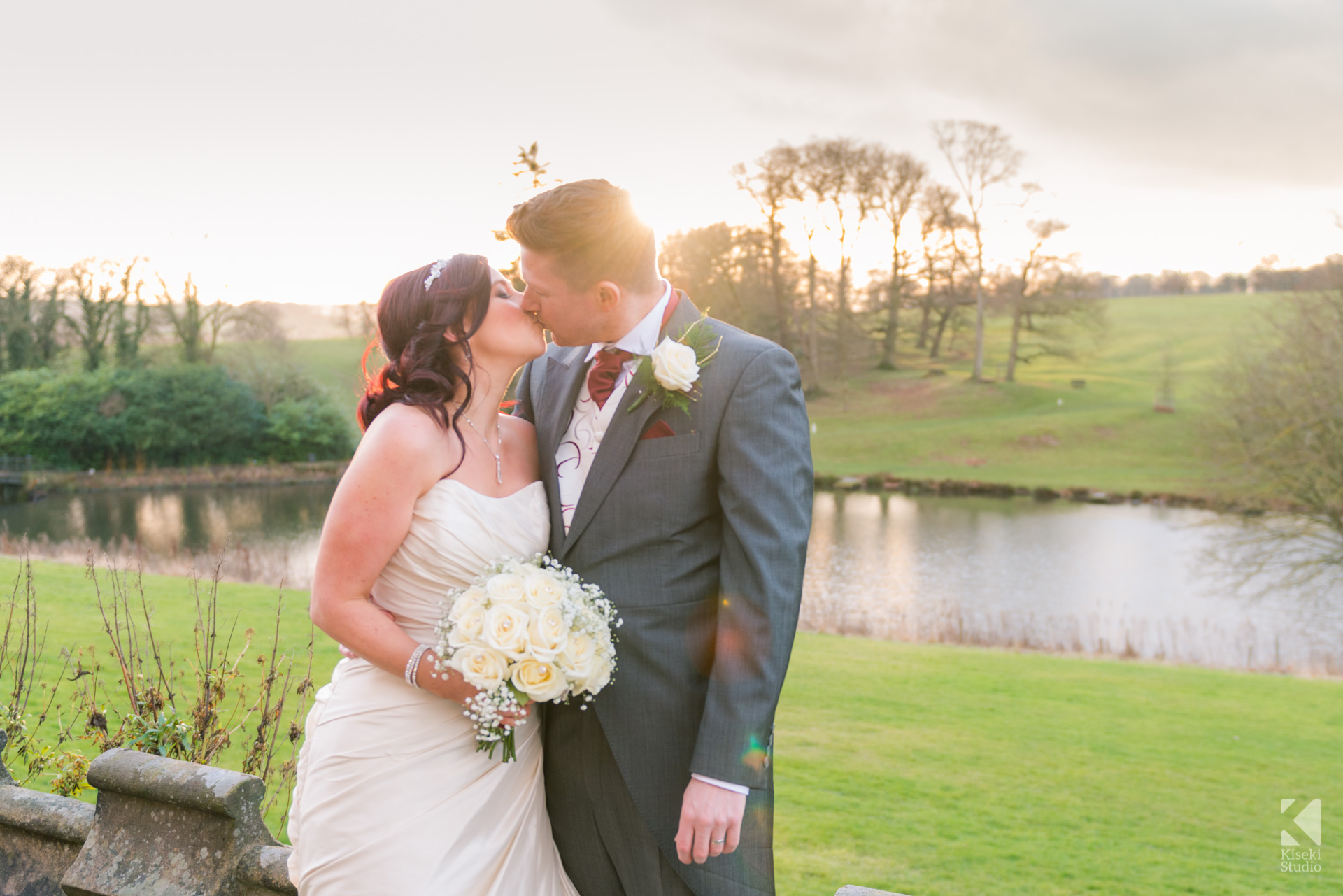 Ripley Castle Wedding - Bride and Groom kissing and sunset