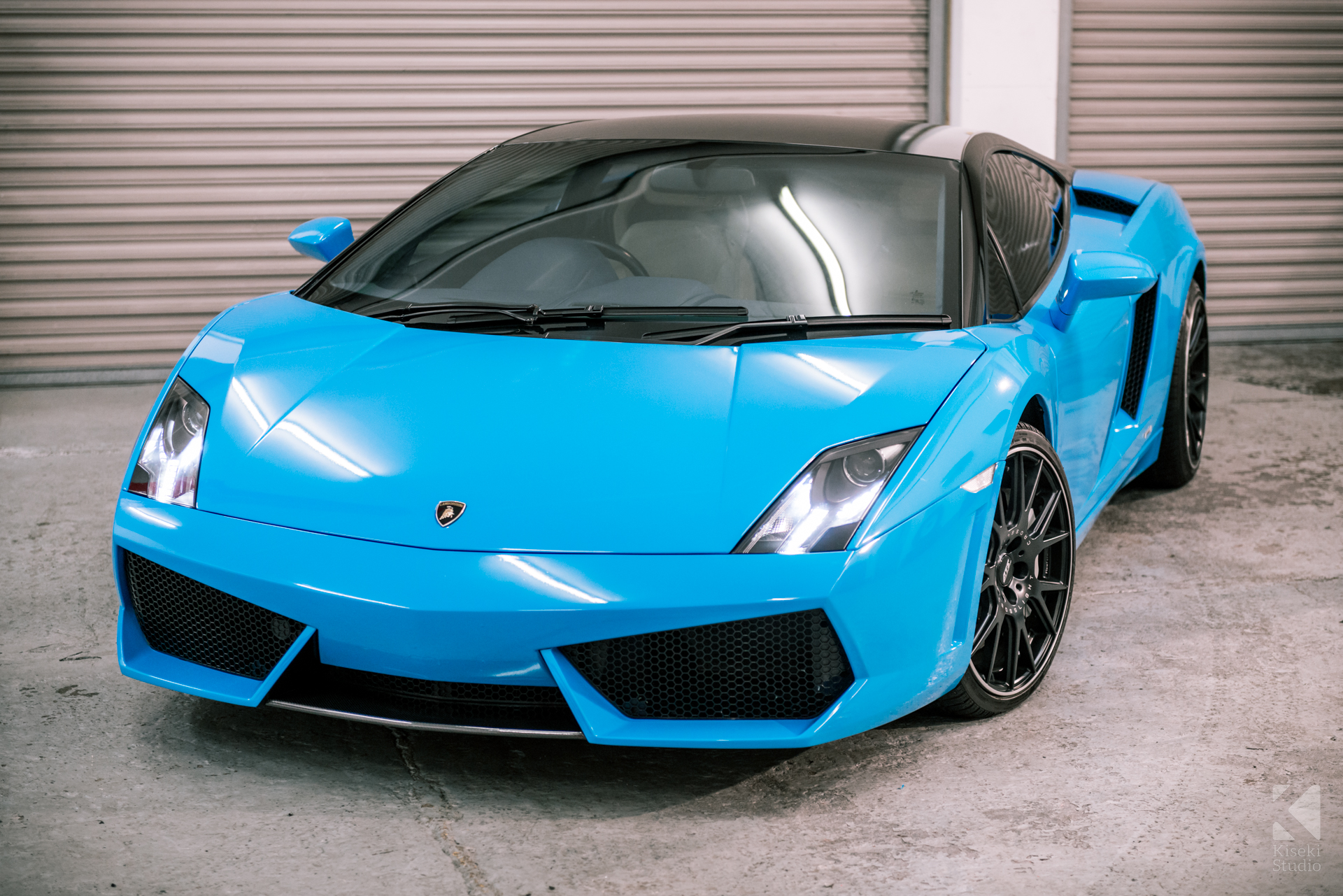 lamborghini-gallardo-full-vinyl-wrap-preparation-video-side-profile-baby-blue-workshop-angle