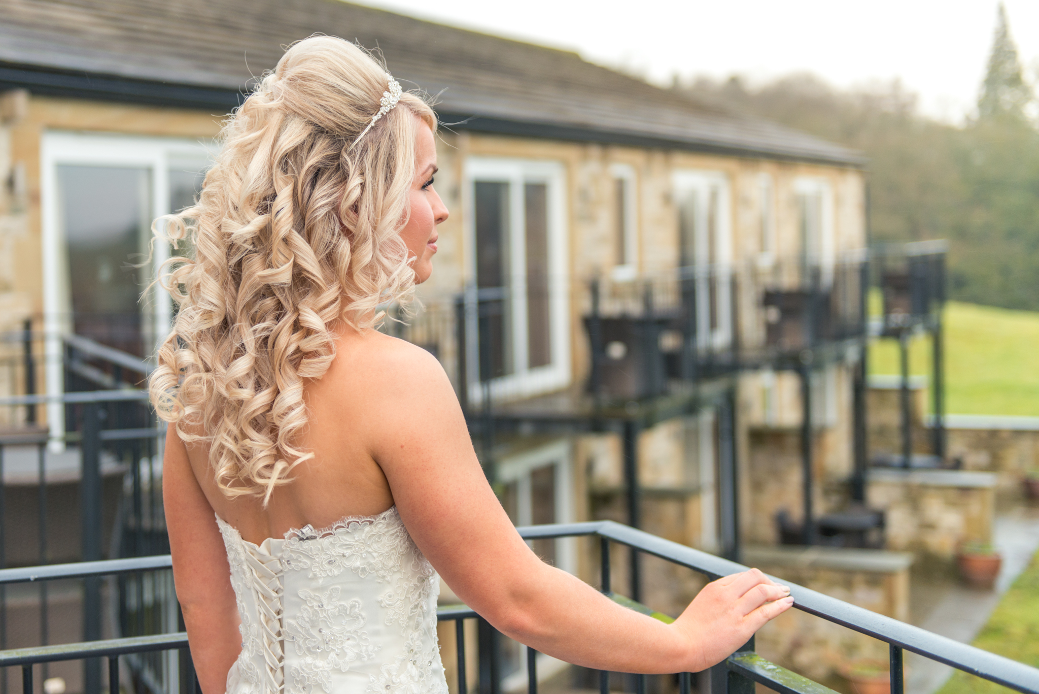bride-preparing-hair-beautiful-balcony-white-dress-wedding-photography-coniston-hall-kiseki-studio